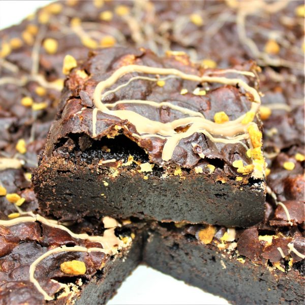 Gluten-free chocolate brownie mix baked and topped with honeycomb and a chocolate drizzle